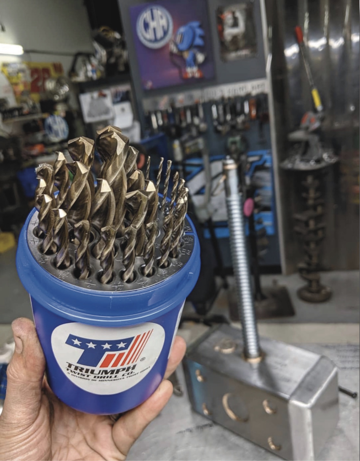 Set of bronze-colored cobalt jobber drill bits in a Triumph storage bucket